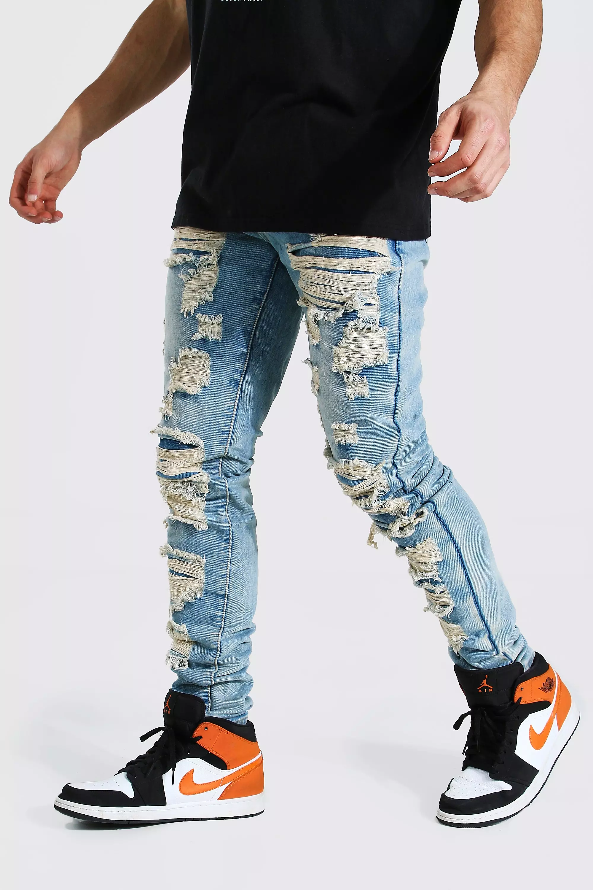 Shredded mens hot sale jeans